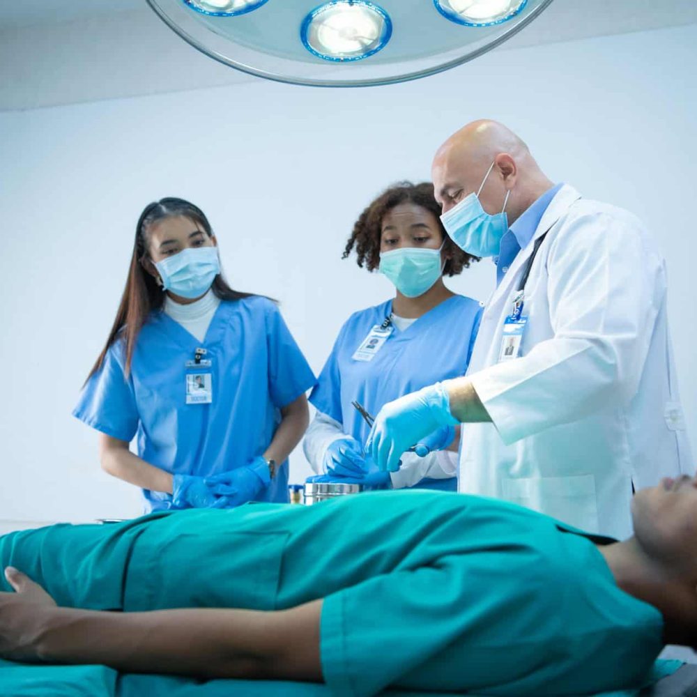 A medical professor is teaching surgery to medical students working at an international medical hospital.