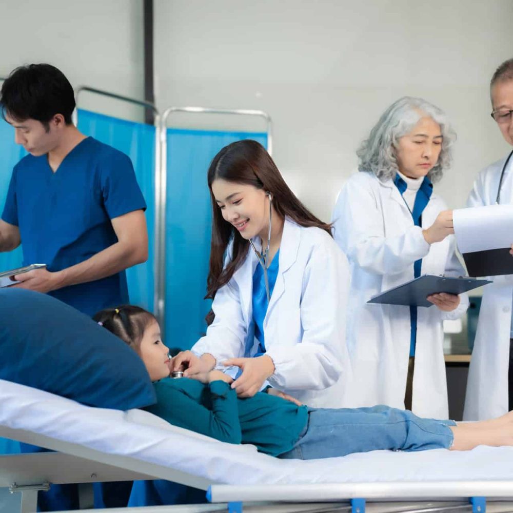 Friendly dental team examining oral health and offering professional care advice for children. Promoting hygiene, healthy smiles, and family-focused dental care services