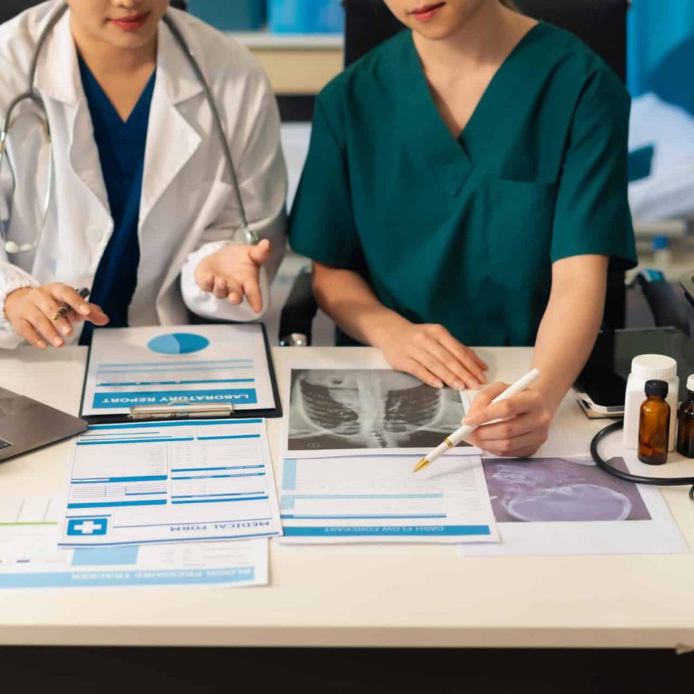 Medical team working on digital tablet healthcare doctor technology tablet using computer analyzed the results of medical reports, an online conference at the hospital.